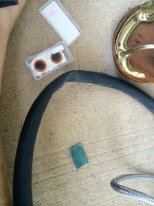 I got my patch kit ready -- it has glue, sandpaper, chalk to mark the spot where the hole is, and patches.