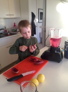 The prickly pear stains the lemonade a vivid color.